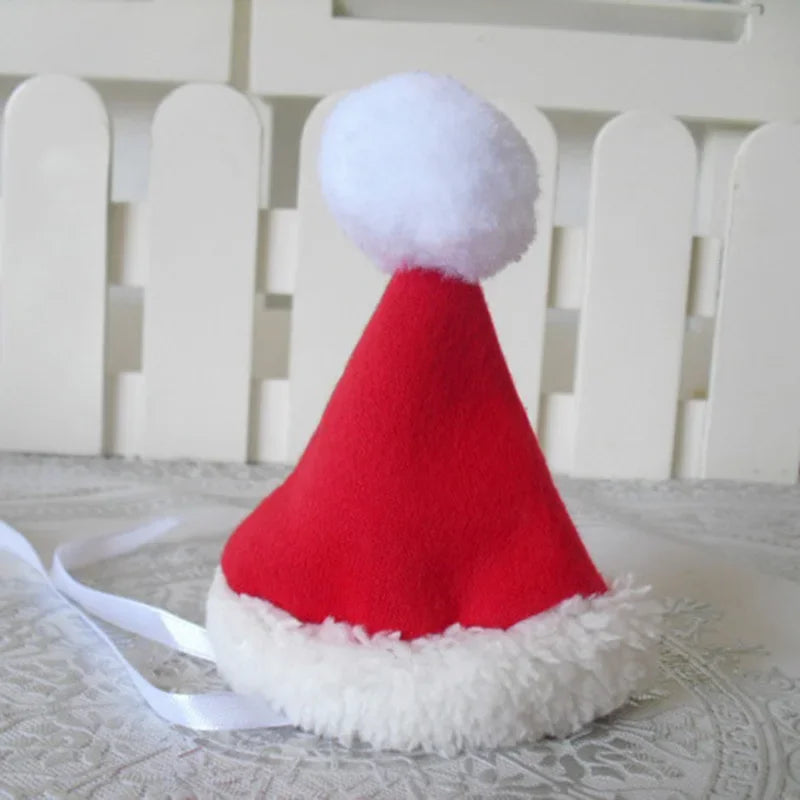 Red Santa hat with white fur trim and pom-pom on a light background