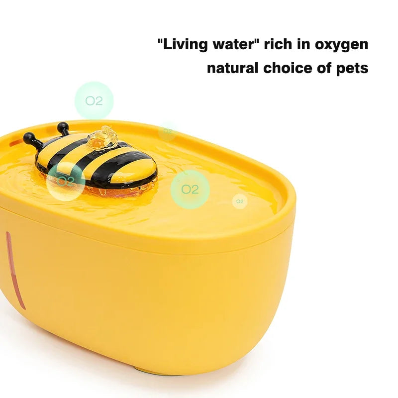 Yellow pet water bowl with bee design on a white background